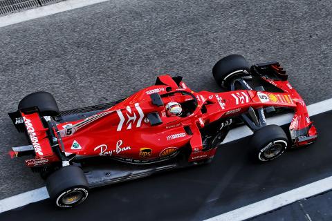 Vettel tops first day of Abu Dhabi test after crash