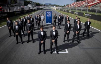 Riders in suits for 70th anniversary of grand prix