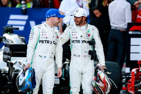 Mercedes F1 drivers race suits to be auctioned for NHS