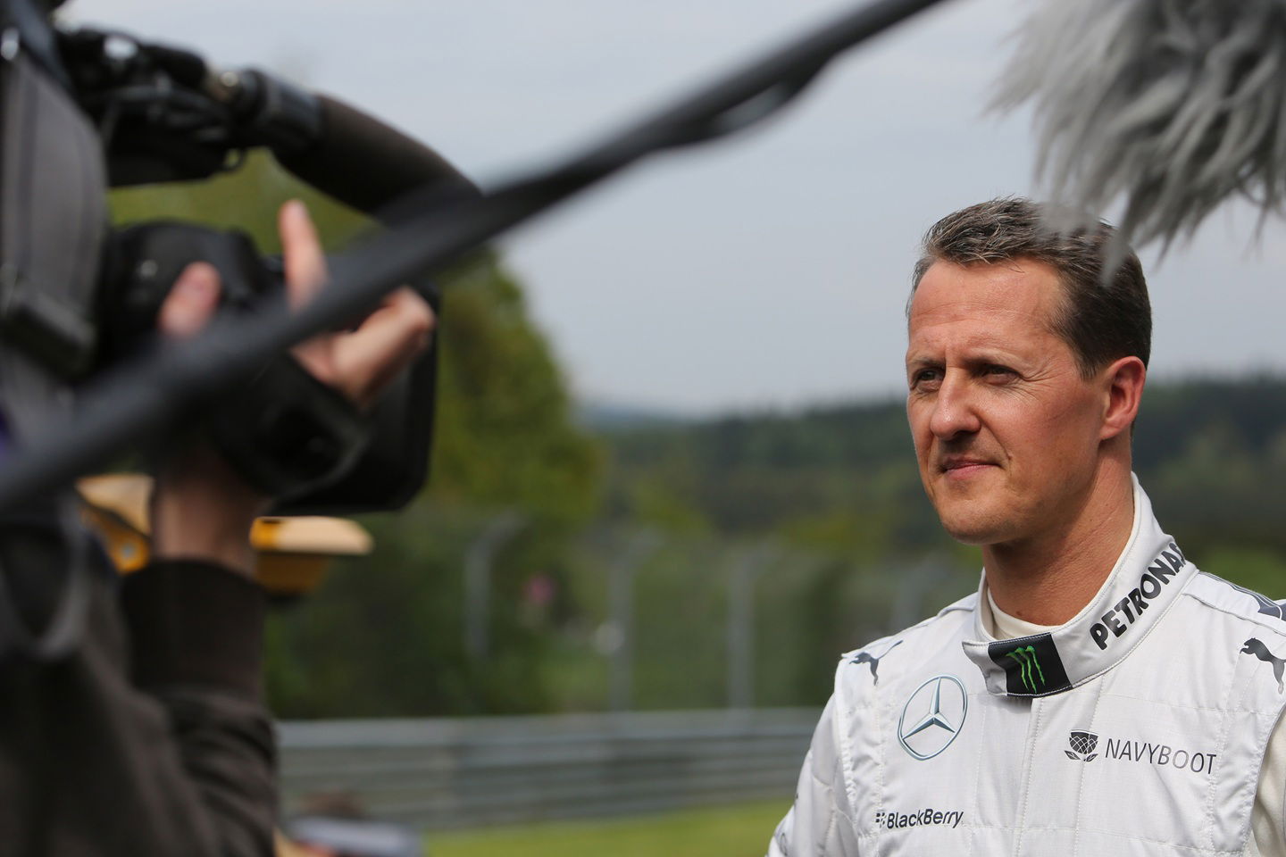 Michael Schumacher signs Jackie Stewart’s helmet for charity